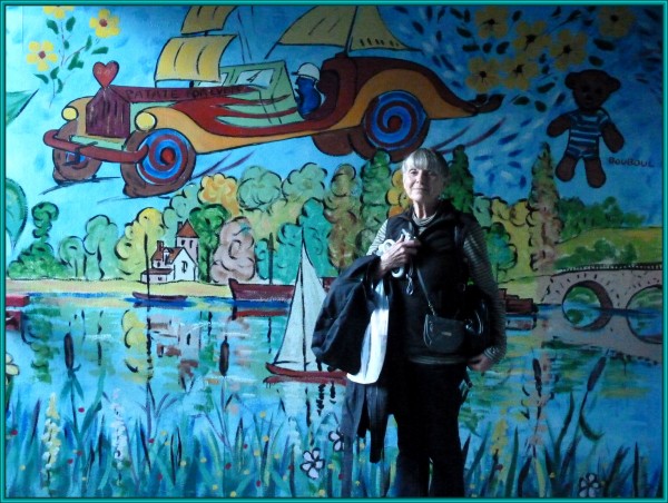 Sandra in the colorful tunnel leading to the train station.